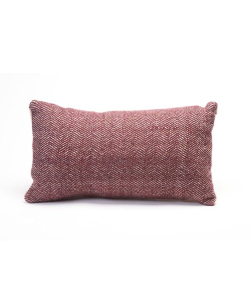 A Biltmore Industries pillow in burgundy by local weaver Deanna Lynch.