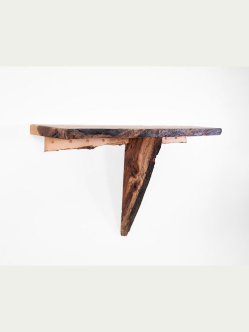 A live edge wall shelf handcrafted by Tom Elman.