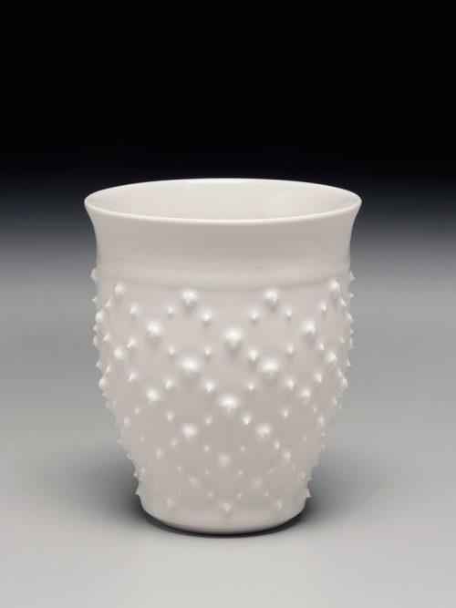 A porcelain diamond sea urchin cup by Asheville artist Anja Bartels.