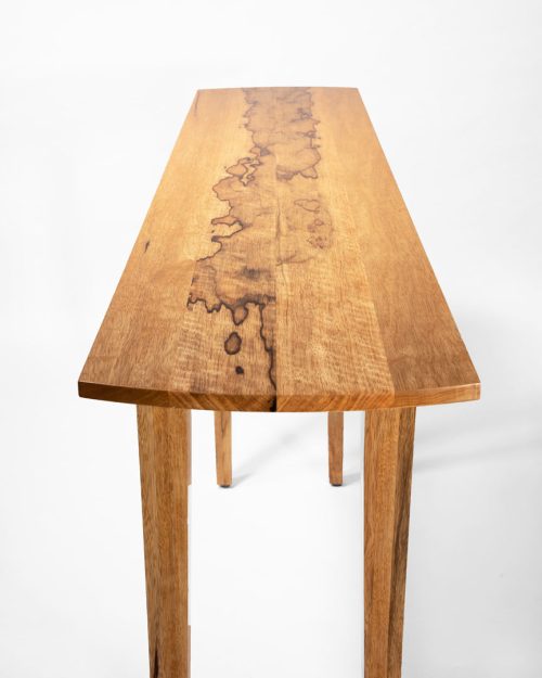 Detail of a hall table hade from sustainably grown black limba by Robin South.