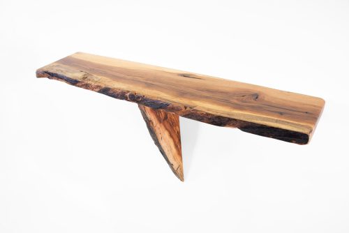 A live edge wall shelf handcrafted from American Chestnut wood.