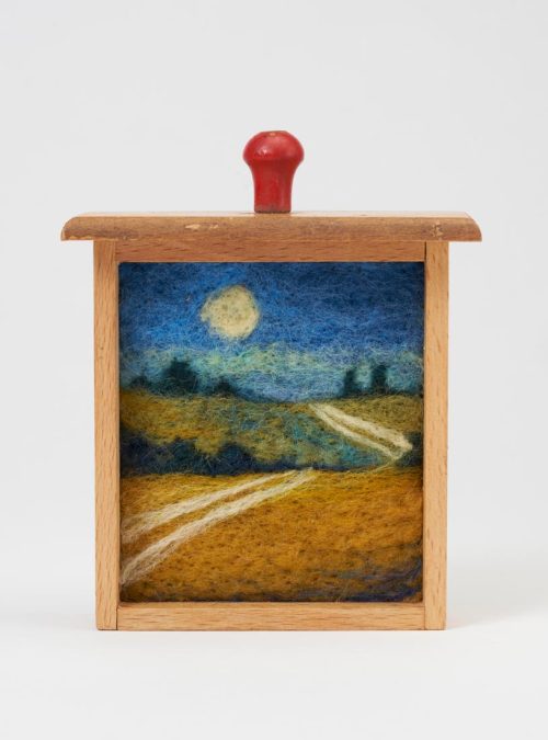 A needle felted landscape titled Blue Gold Hills by Jaana Mattson.