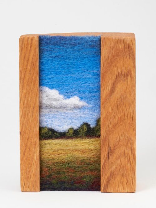 A needle felted landscape titled Field by Jaana Mattson.