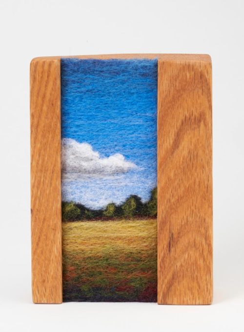 A needle felted landscape titled Field by Jaana Mattson.