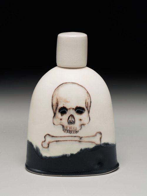 A ceramic skull flask handcrafted by potter Phil Haralam.