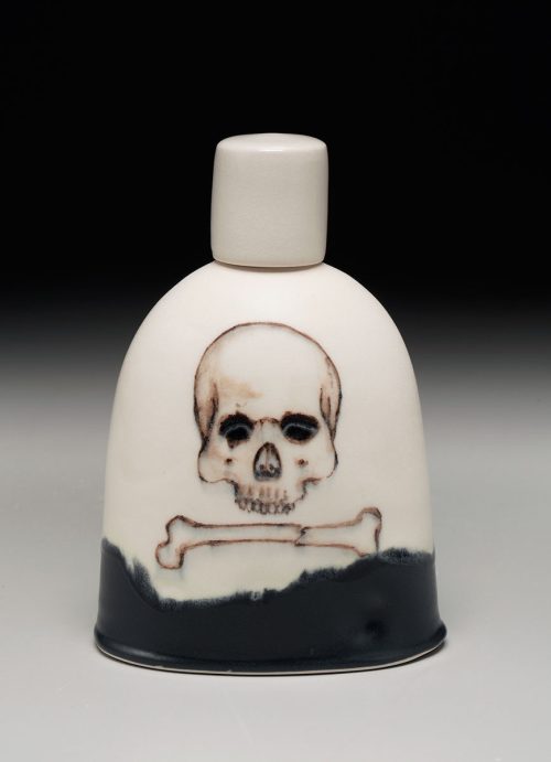 A ceramic skull flask handcrafted by potter Phil Haralam.