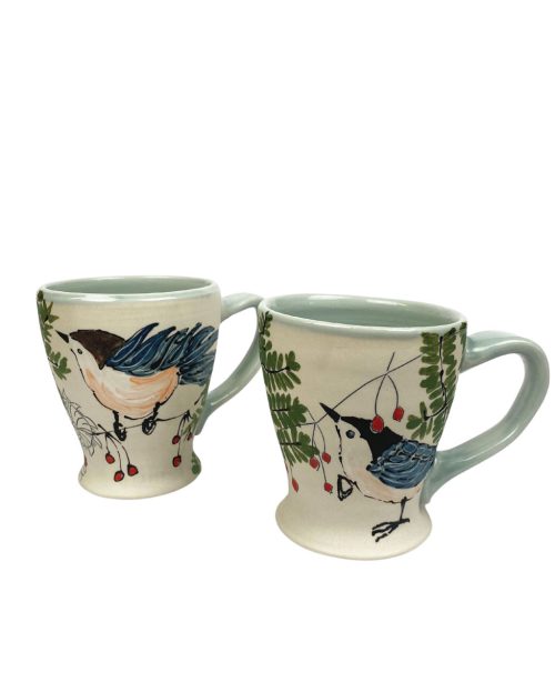 A pair of Irish coffee mugs by artist Rebekah Strickland.