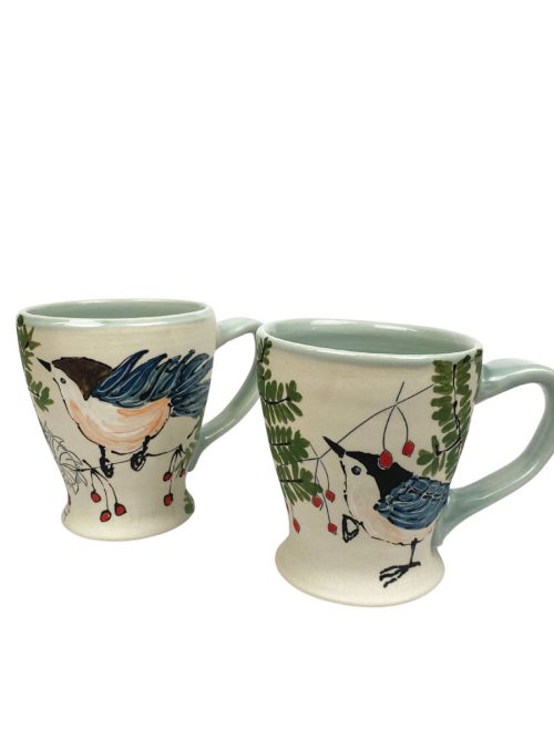 A pair of Irish coffee mugs by artist Rebekah Strickland.