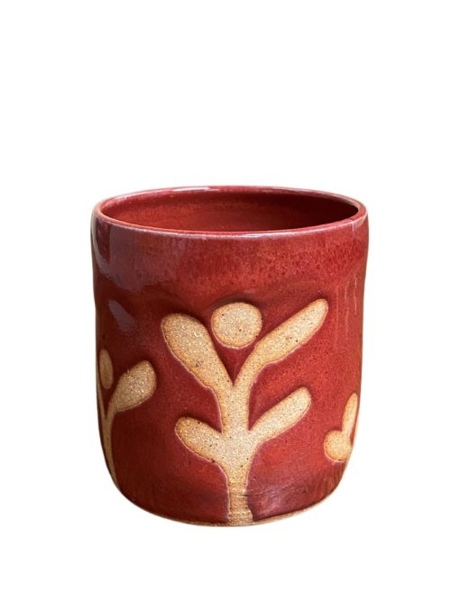 Red ceramic rocks cup by Mangum Pottery.