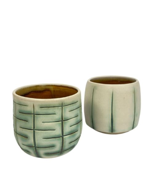 Ceramic carved tumbler set by Ruth Hesse.