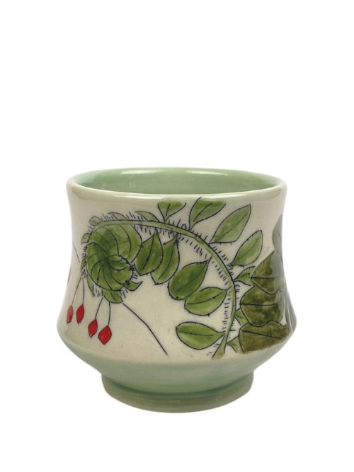 Ceramic sipper with ferns and winter berries by artist Rebekah Stickland.