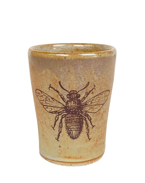 Ceramic cup with a bee motif by Julie Covington.