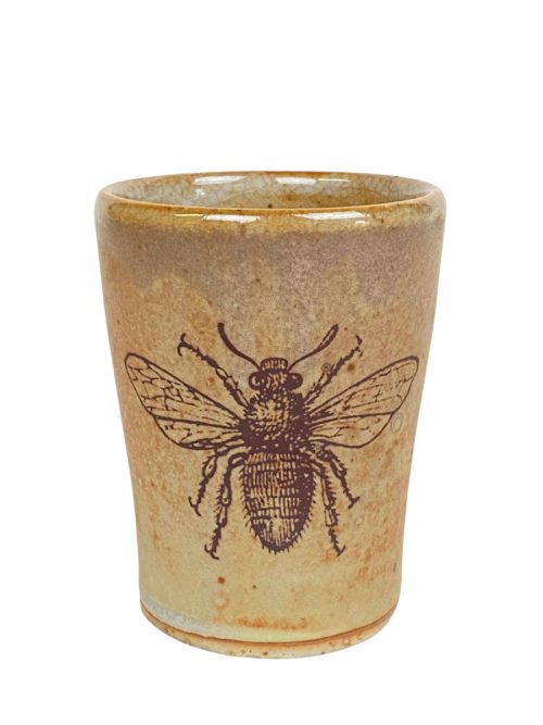 Ceramic cup with a bee motif by Julie Covington.