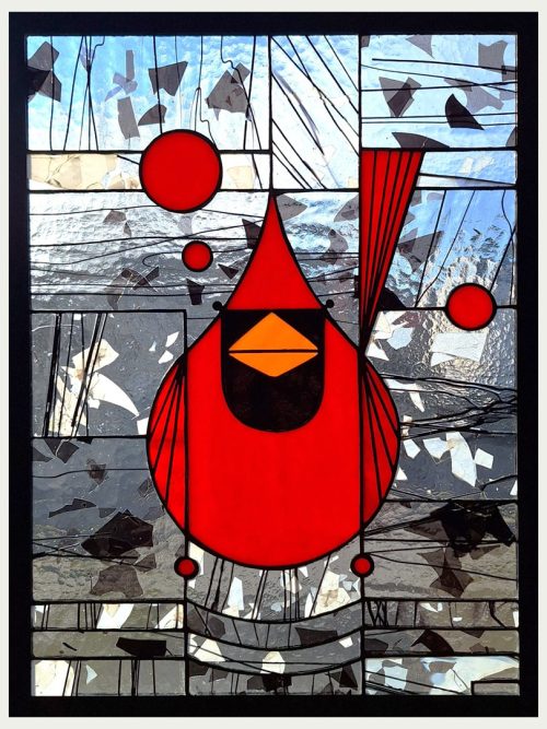 A stained glass window panel of a cardinal by Hinnenkamp Glass Crafters.