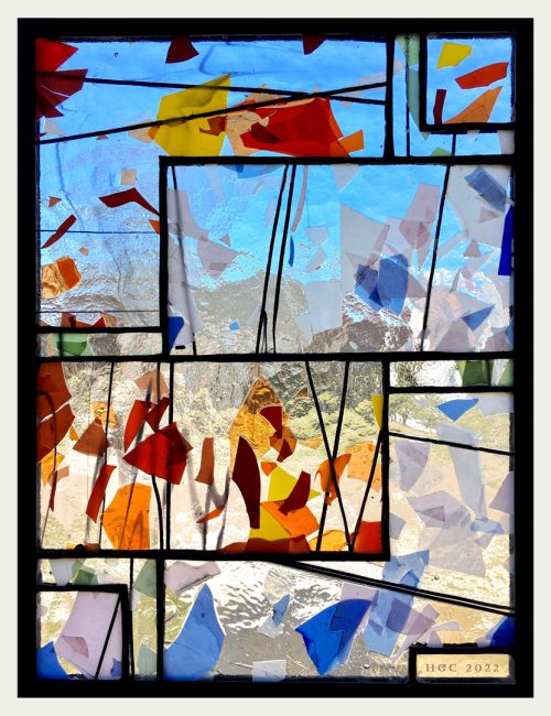 A stained glass window panel titled Fractured VIII by Jacob Hinnenkamp of Hinnenkamp Glass Crafters.