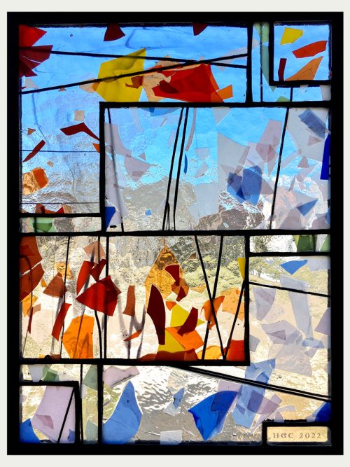 A stained glass window panel titled Fractured VIII by Jacob Hinnenkamp of Hinnenkamp Glass Crafters.