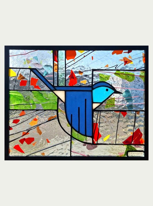 A stained glass window panel titled Mountain Bluebird by Hinnenkamp Glass Crafters.