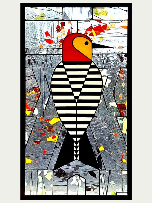 A stained glass window panel by Jacob Hinnenkamp titled Woodpecker XVII.