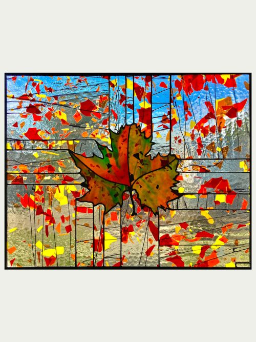 A stained glass window panel titled Fractured Fall by Hinnenkamp Glass Crafters.